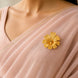 gold plated floral unisex brooch on pink saree DBR22