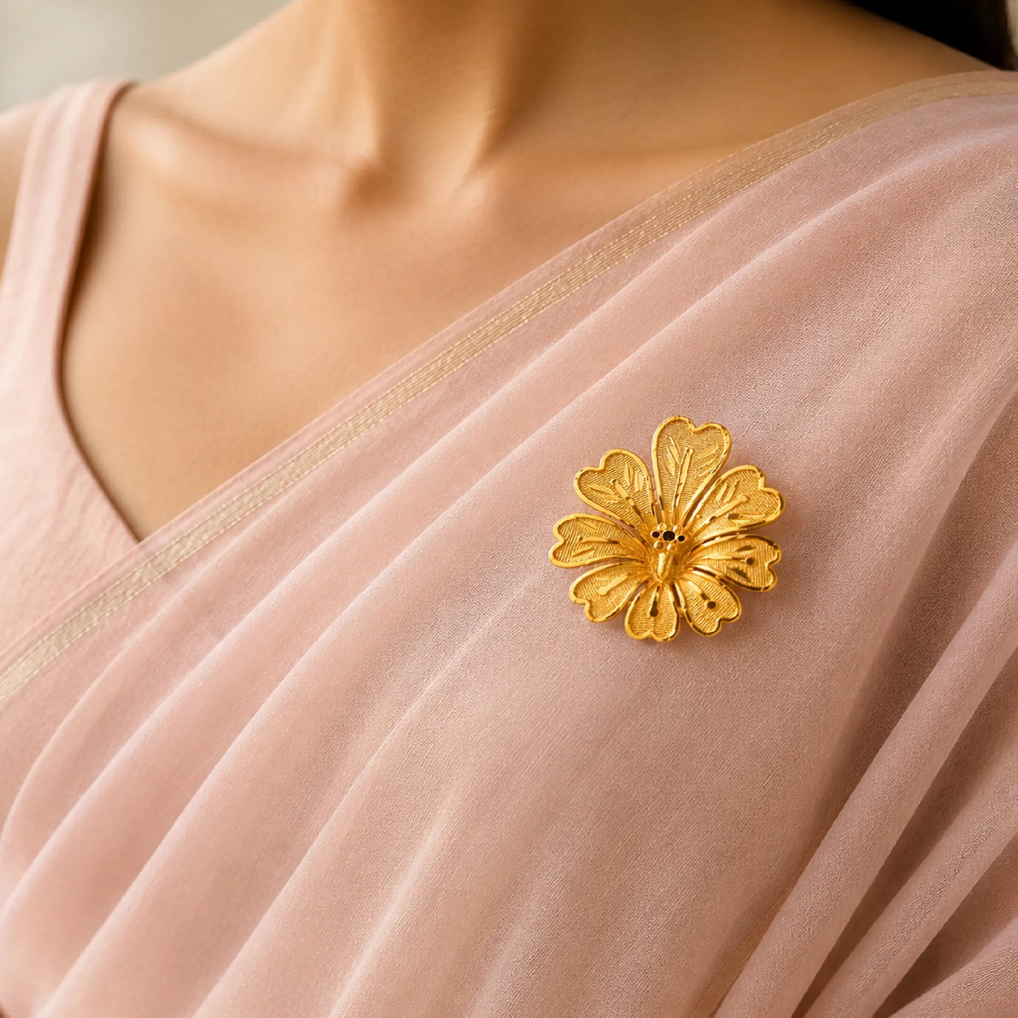gold plated floral unisex brooch on pink saree DBR22