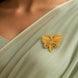 Gold plated butterfly filigree unisex brooch on green saree DBR30