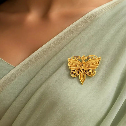 Gold plated butterfly filigree unisex brooch on green saree DBR30